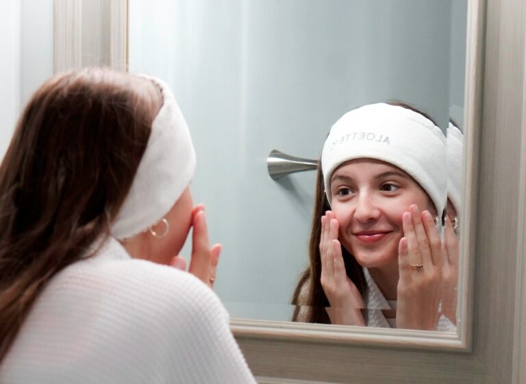 young woman washin her face with Aloette skincare